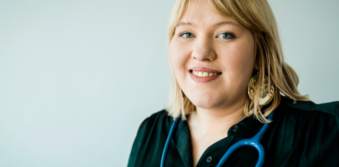 headshot of a smiling young female doctor