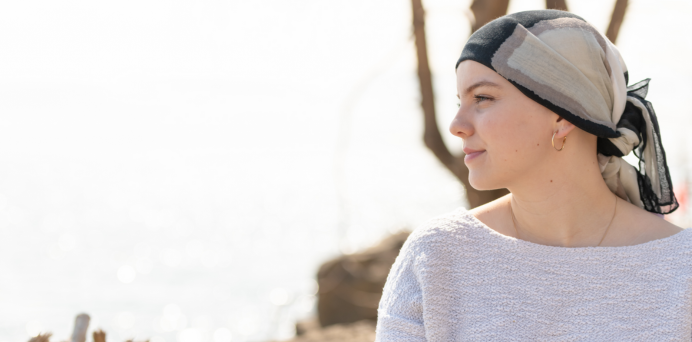 side profile of young woman wearing a headscarf 