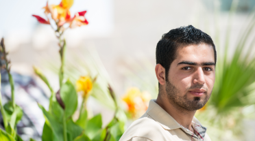 young man with native plants in the background