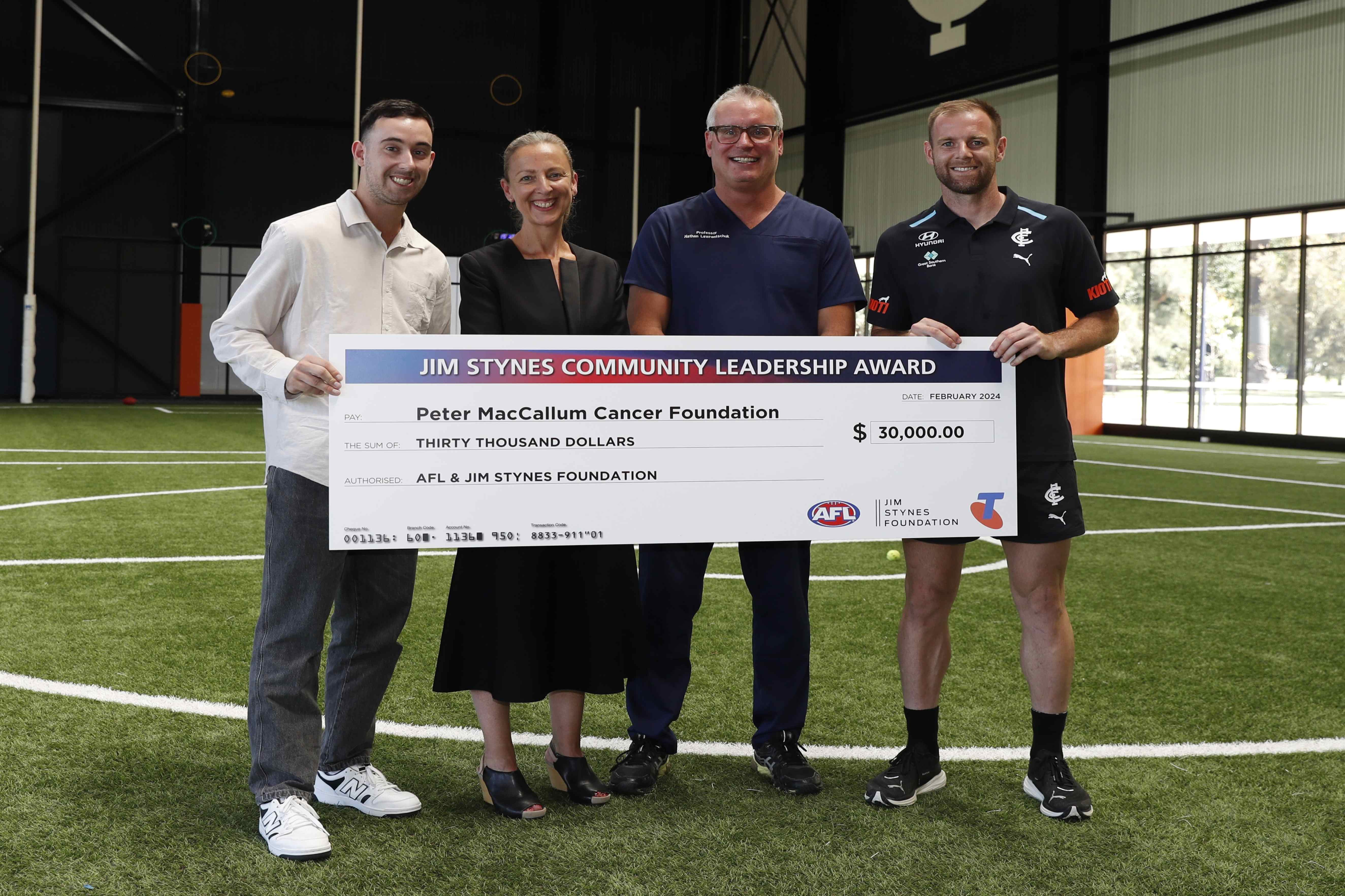 (L-R) Blues supporter and cancer survivor Liam Contarin, CEO of the Peter Mac Foundation, Kate Torney, Prof Nathan Lawrentschuk and Carlton's Sam Docherty. Photo: Sarah Morton/AFL Photos 
